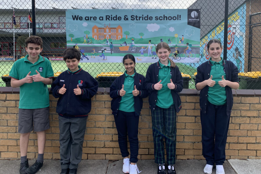 school kids in front of Ride & Stride sign