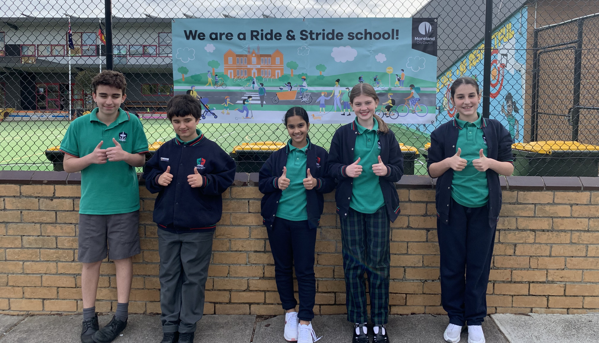 school kids in front of Ride & Stride sign