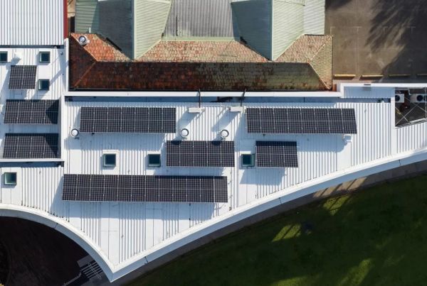 Overhead view of a sports pavilion with solar panels on roof